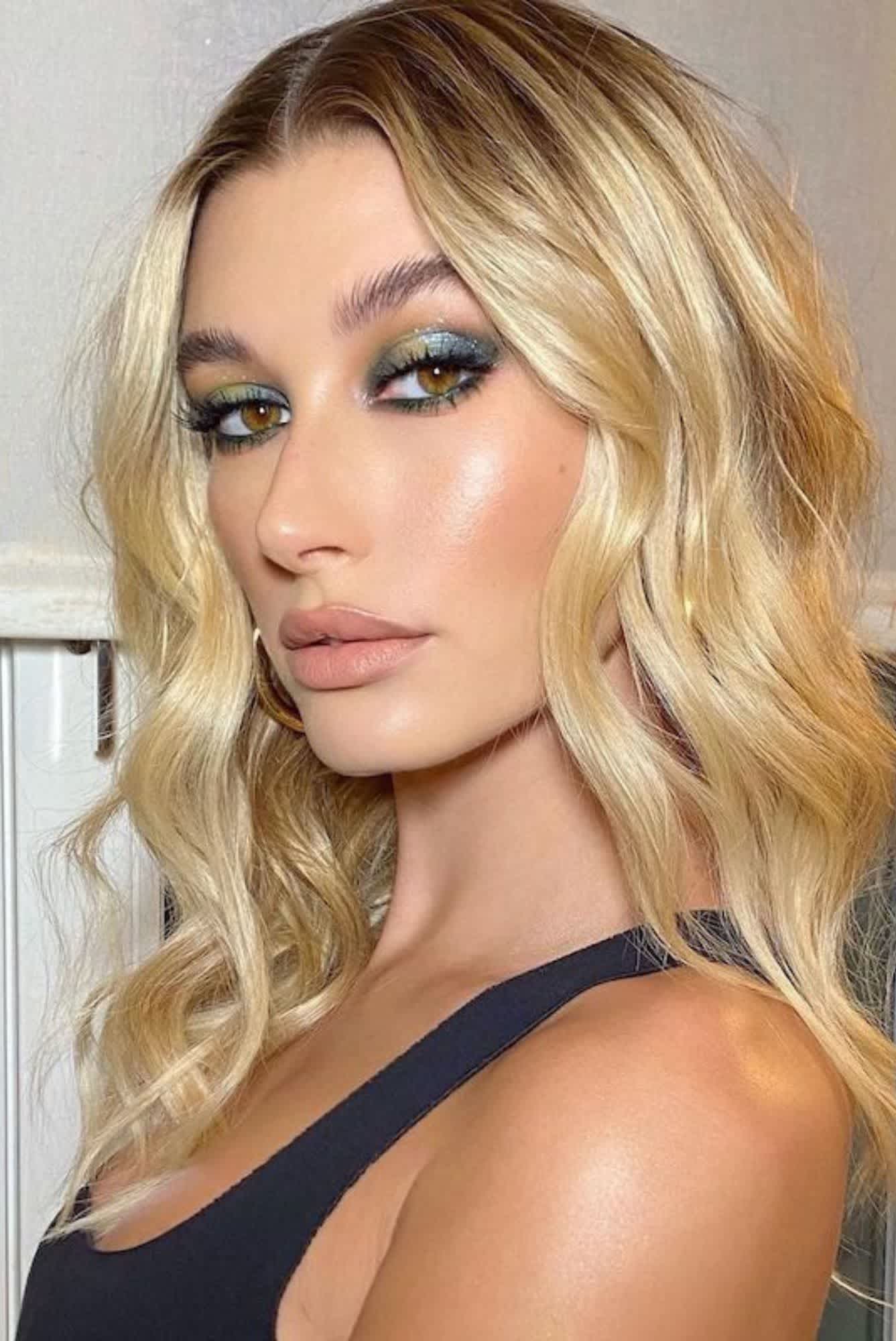 Hailey Bieber plays with varying depths of green eye makeup