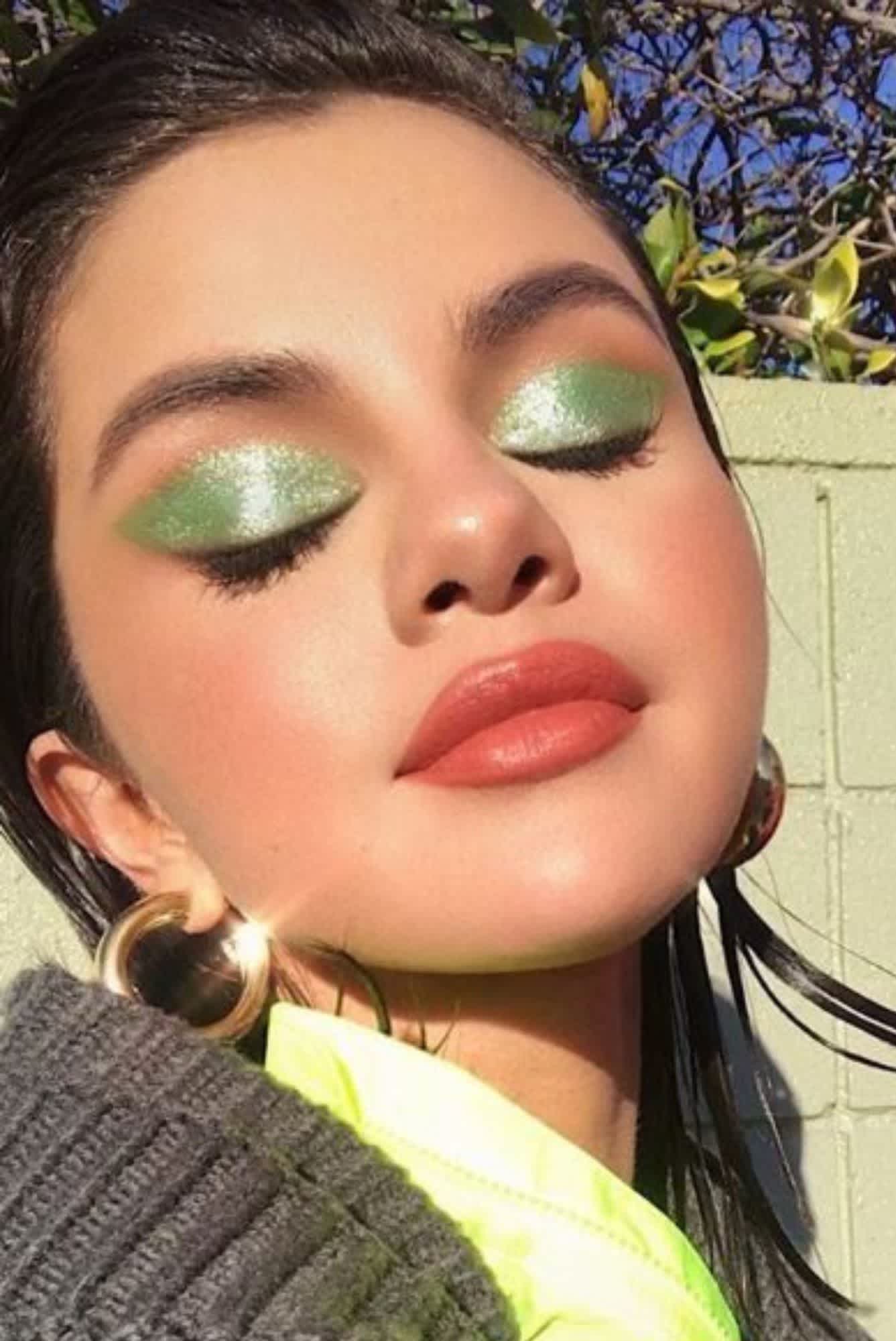 Selena Gomez with a pastel wash of green eye makeup applied by Hung Van Go
