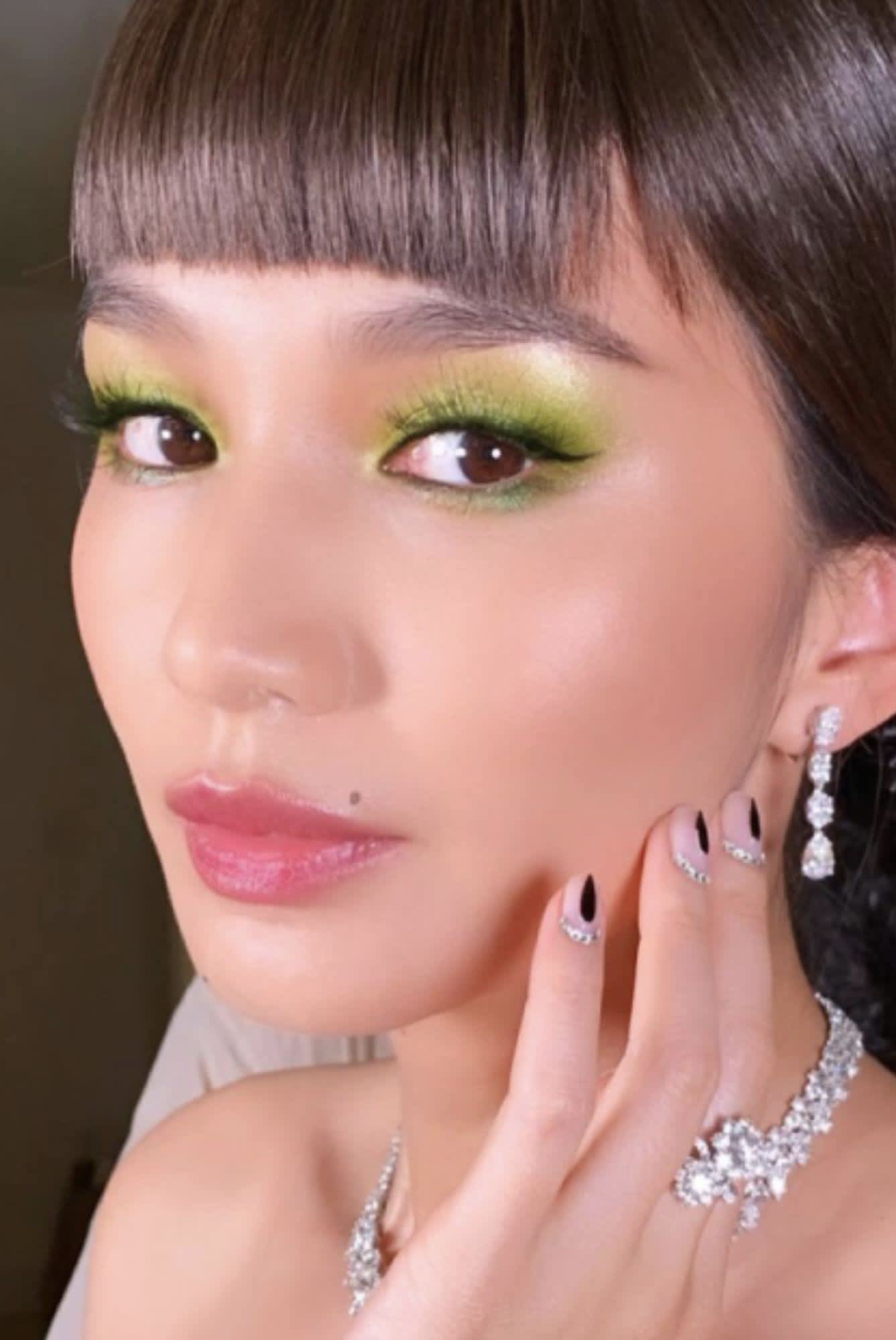 Gemma Chan pre 2021 Met Gala with a lime green eye makeup look