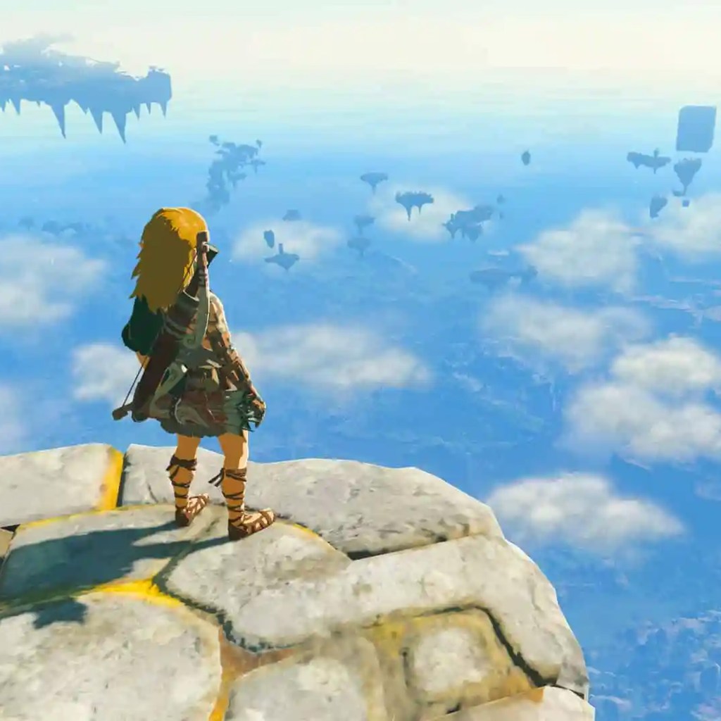 Link standing on the edge of a floating island in "The Legend of Zelda: Tears of the Kingdom".