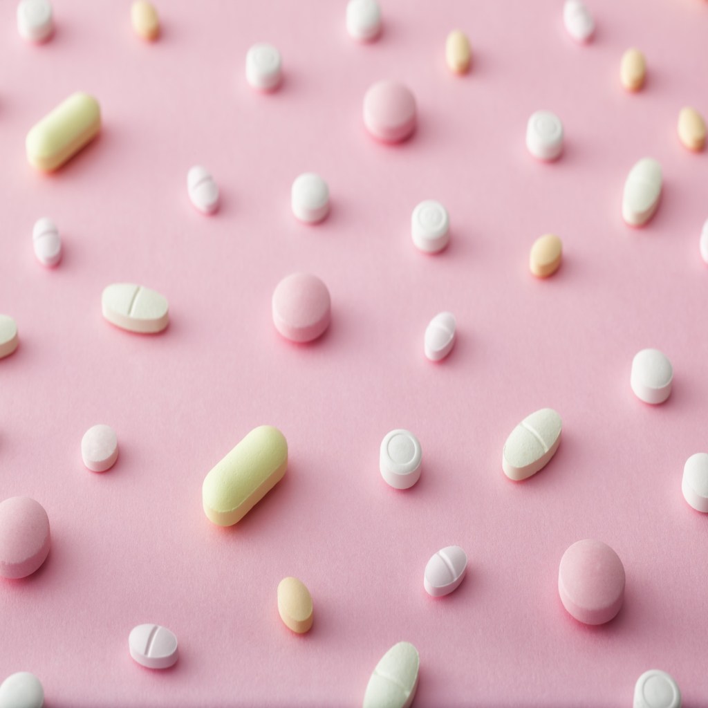 contraceptive pills pink background