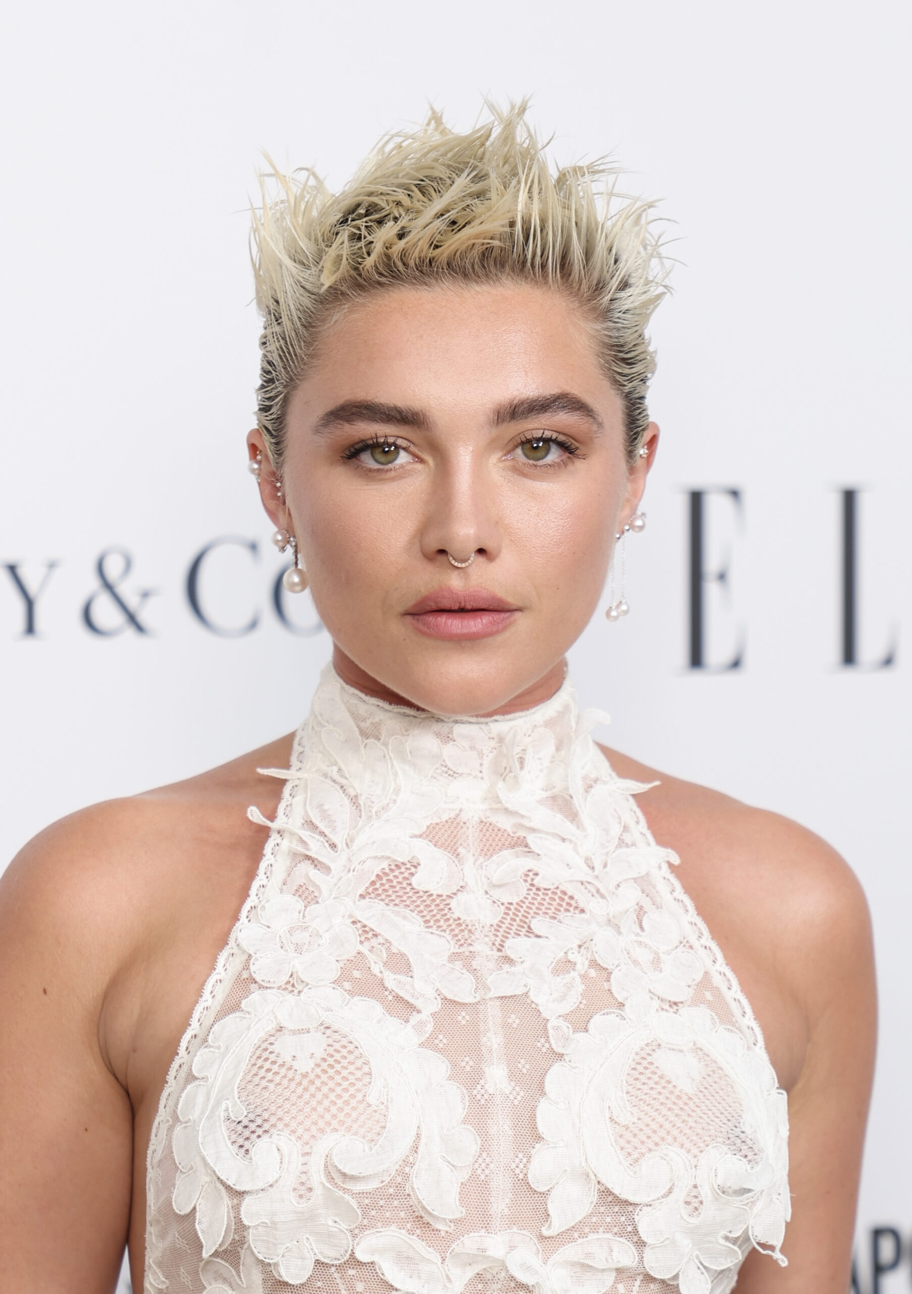 Florence Pugh gives punk bride energy in sheer white lace dress